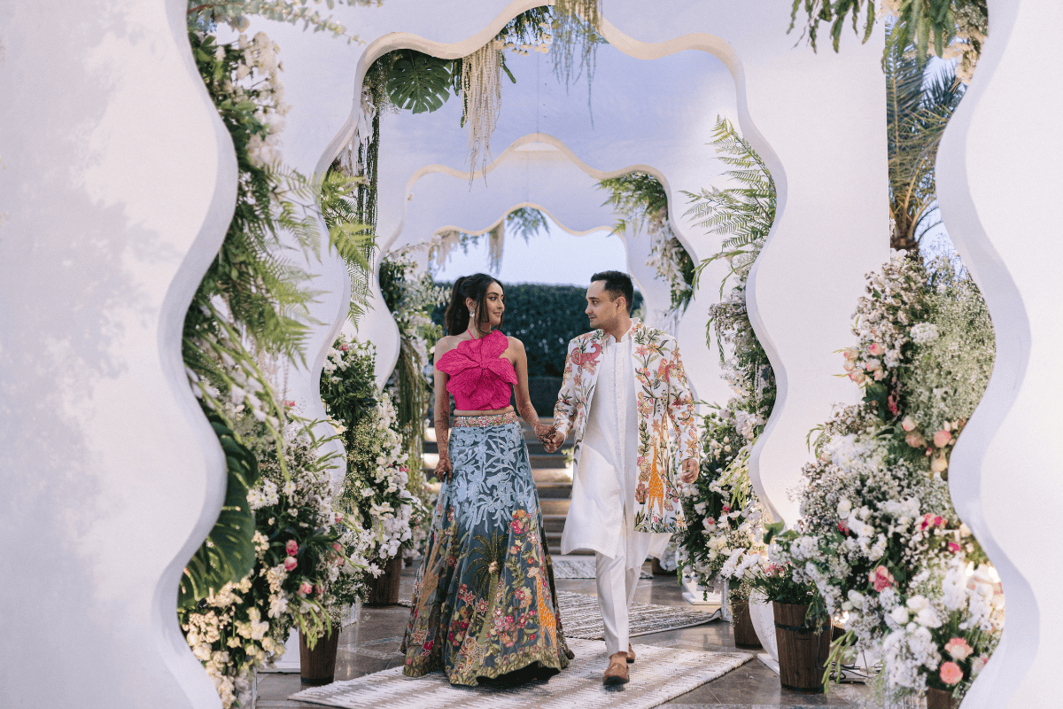 Gorgeous entrance décor with flowers and lighting for a luxury Indian wedding planned by A3Cube Events India, photographed by Ptaufiq Photography.