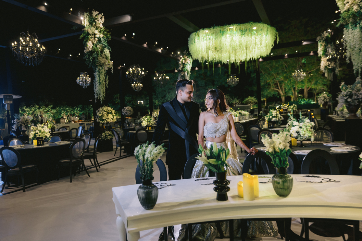 Bride and groom celebrating their luxury Indian wedding designed by A3Cube Events India, captured by Ptaufiq Photography.